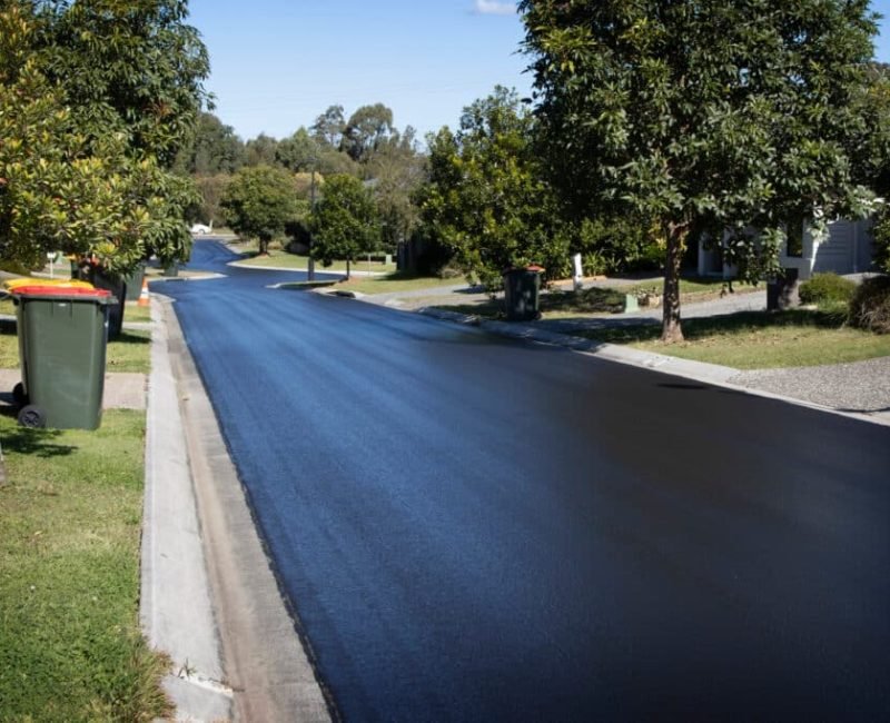 Suburban Road Resurfaced with Fresh Asphalt. Construction of new Suburban Road Resurfaced with Fresh Asphalt. Construction of new